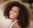 Happy smiling african descent child with afro hair style